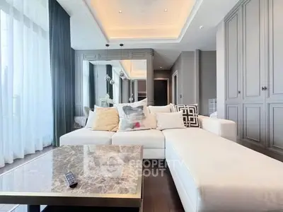 Luxurious living room with elegant decor and spacious seating area.