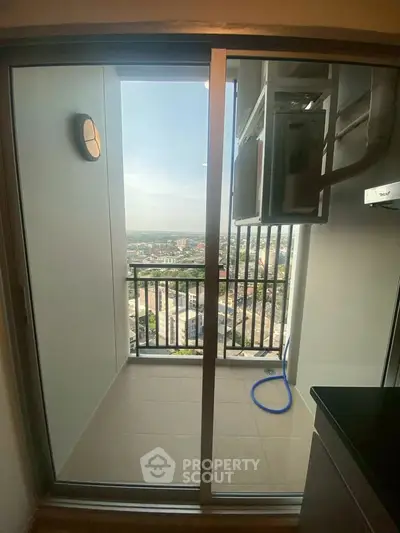 Modern apartment balcony with stunning city view and sliding glass door