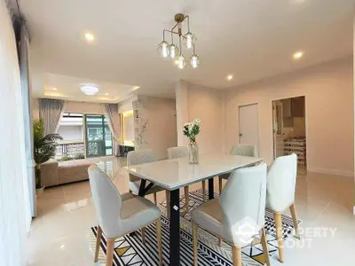 Spacious modern dining area with elegant lighting and stylish decor