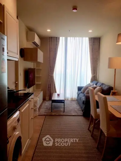 Cozy living room with modern kitchen in open layout apartment