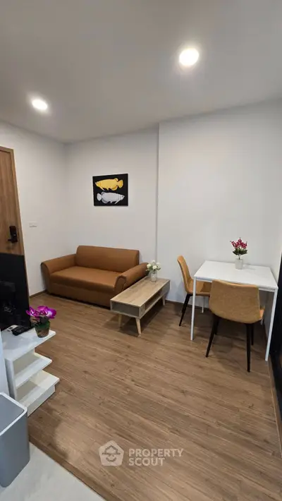 Modern living room with cozy sofa and dining area, perfect for urban living.