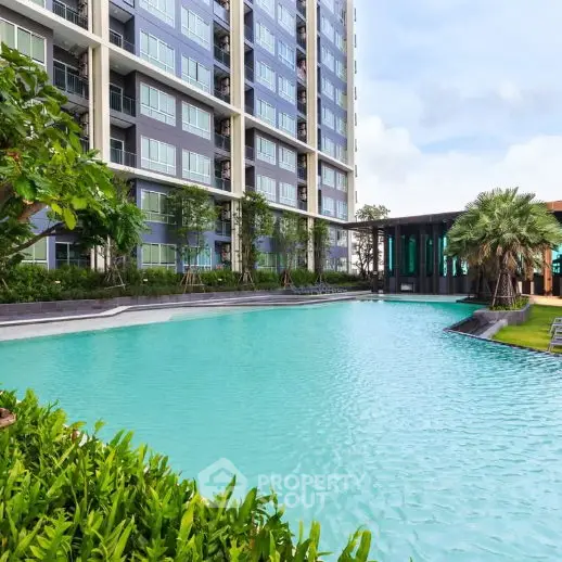 Luxurious condominium with stunning pool and lush greenery, perfect for modern living.