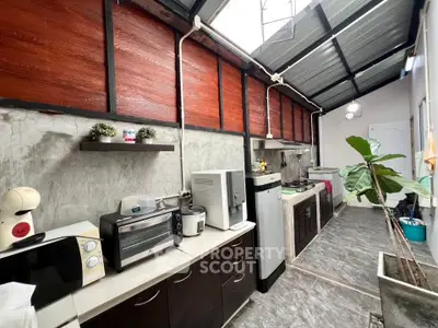 Charming kitchen with modern appliances and rustic design, featuring open layout and ample natural light.