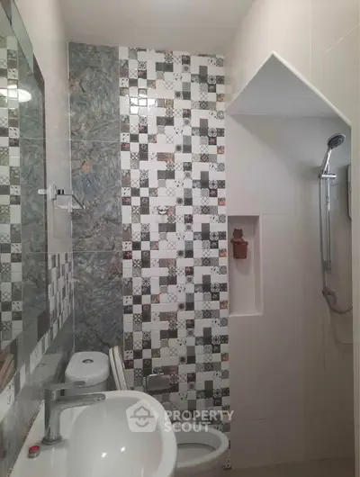 Modern bathroom with stylish tile design and sleek fixtures