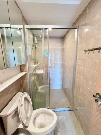 Modern bathroom with glass shower and sleek fixtures