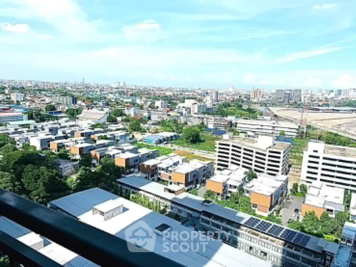 Stunning cityscape view from high-rise balcony overlooking urban landscape.