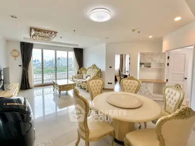 Luxurious living room with elegant furniture and stunning city view from large windows.