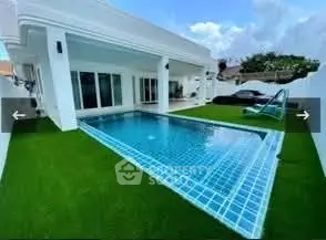 Luxurious villa with private pool and lush green lawn, perfect for relaxation and entertainment.