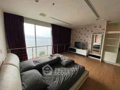 Spacious bedroom with stunning ocean view and modern decor