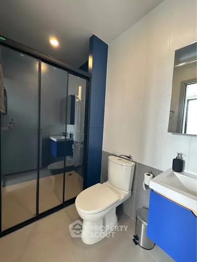 Modern bathroom with sleek shower enclosure and contemporary fixtures