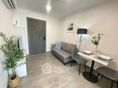 Modern living room with cozy sofa and dining area in stylish apartment.