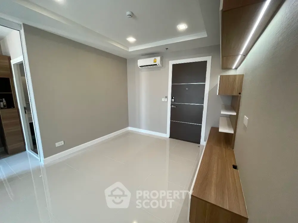 Modern minimalist living room with sleek design and built-in storage