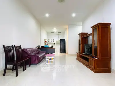 Spacious living room with elegant wooden furniture and modern decor