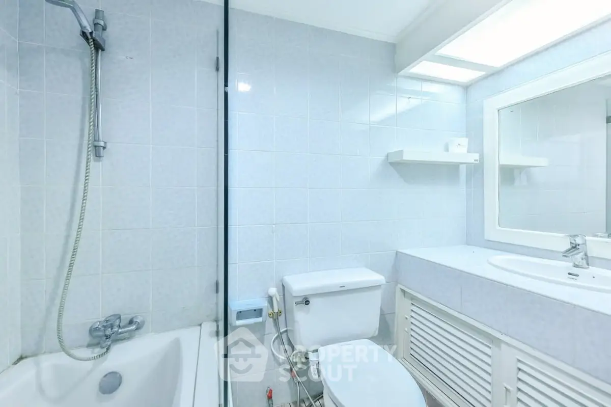 Bright and clean bathroom with bathtub and modern fixtures