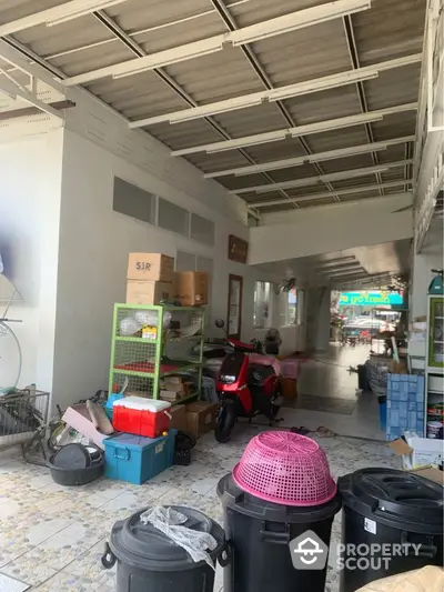 Spacious storage area with scooter and organized shelving in a commercial property.