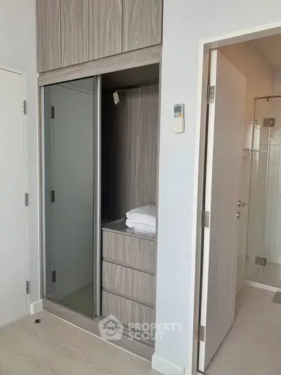 Modern bedroom with built-in wardrobe and bathroom access