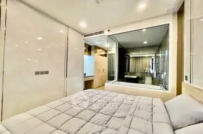 Luxurious modern bedroom with glass partition and elegant decor