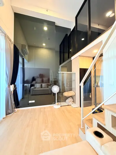 Modern duplex living room with high ceilings and stylish decor