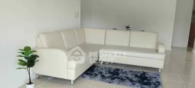 Modern living room with white sectional sofa and stylish decor