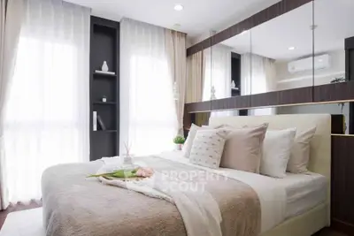 Luxurious bedroom with elegant decor and large windows for natural light