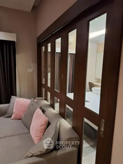 Modern living room with sliding glass doors and stylish sofa