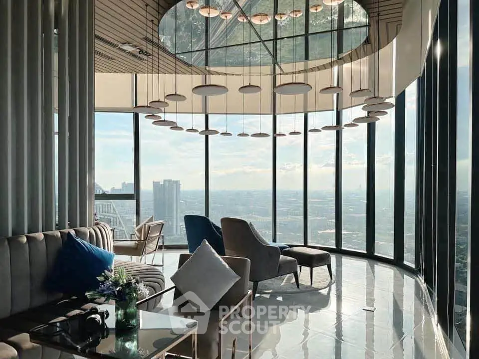 Luxurious modern living room with panoramic city views and elegant decor.