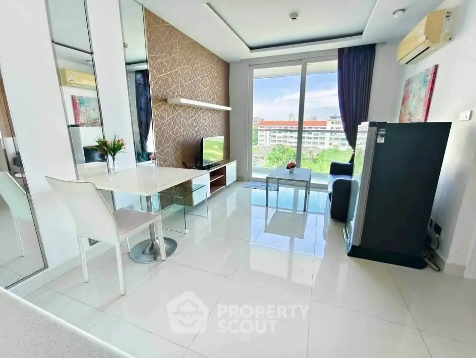 Modern living room with sleek design, large window, and stylish furniture offering a bright and airy ambiance.