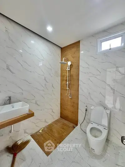 Modern bathroom with elegant marble tiles and sleek fixtures