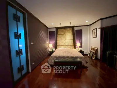 Luxurious bedroom with elegant decor and ambient lighting