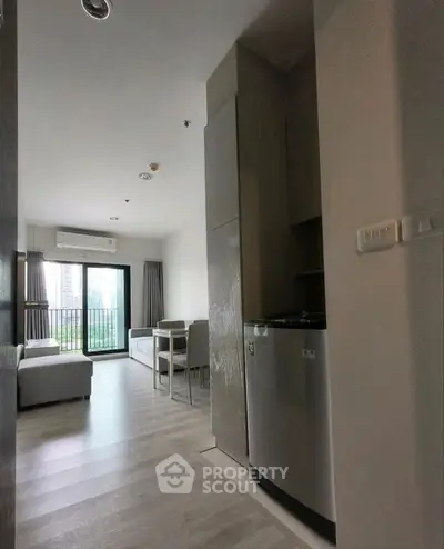 Modern living room with large windows and stylish decor