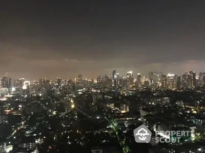 Stunning city skyline view at night with illuminated skyscrapers and urban landscape