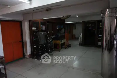 Spacious basement storage area with ample shelving and storage solutions.