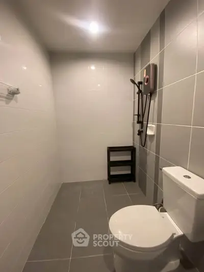 Modern bathroom with sleek gray tiles and contemporary fixtures