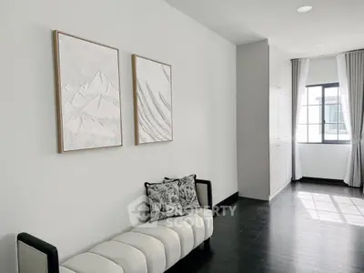 Modern minimalist living room with elegant decor and natural light