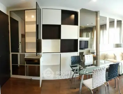 Modern living room with stylish furniture and built-in storage