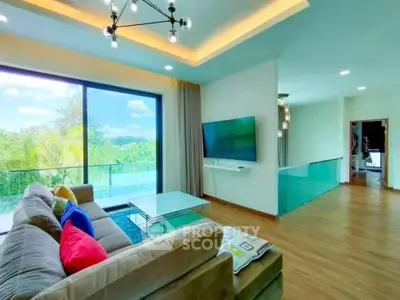 Spacious living room with modern decor and large balcony view.