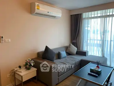 Modern living room with cozy sofa and balcony view