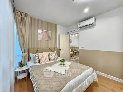 Cozy bedroom with elegant decor and air conditioning in modern apartment
