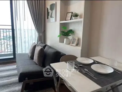 Modern living room with stylish decor and balcony view in urban apartment