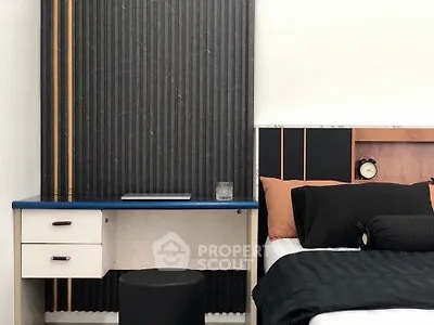Modern bedroom with stylish headboard and compact study desk