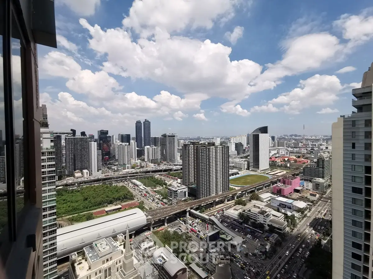 Stunning cityscape view from high-rise building showcasing urban skyline and vibrant city life.