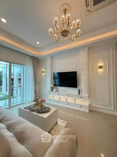 Luxurious living room with elegant chandelier and modern decor