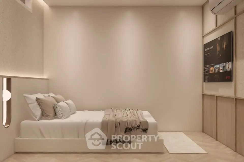 Modern minimalist bedroom with cozy lighting and wall-mounted TV