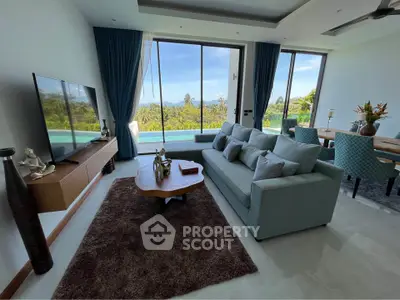 Luxurious living room with stunning pool view and elegant decor