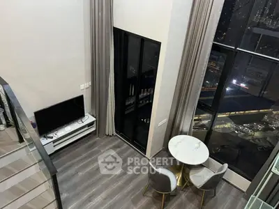 Modern loft apartment with high ceilings and city view