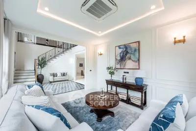 Luxurious living room with elegant decor and spacious layout, featuring modern furniture and stylish artwork.