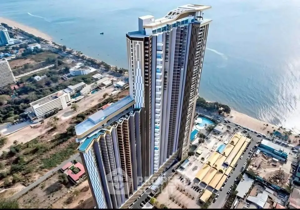 Stunning high-rise beachfront condominium with panoramic ocean views and modern architecture.