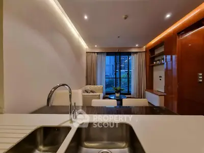 Modern open-layout living room with sleek kitchen sink and city view.