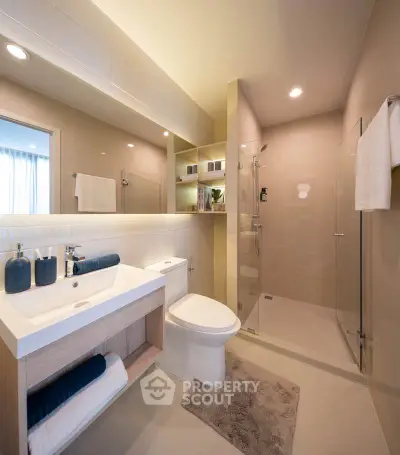 Modern bathroom with sleek fixtures and glass shower enclosure