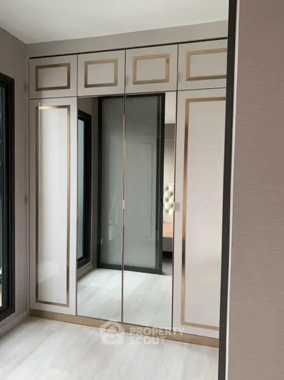Elegant bedroom with modern built-in wardrobe and stylish decor
